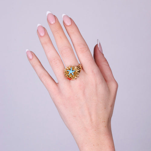 ANELLO IN METALLO CON RICCIO DI MARE E STELLA MARINA